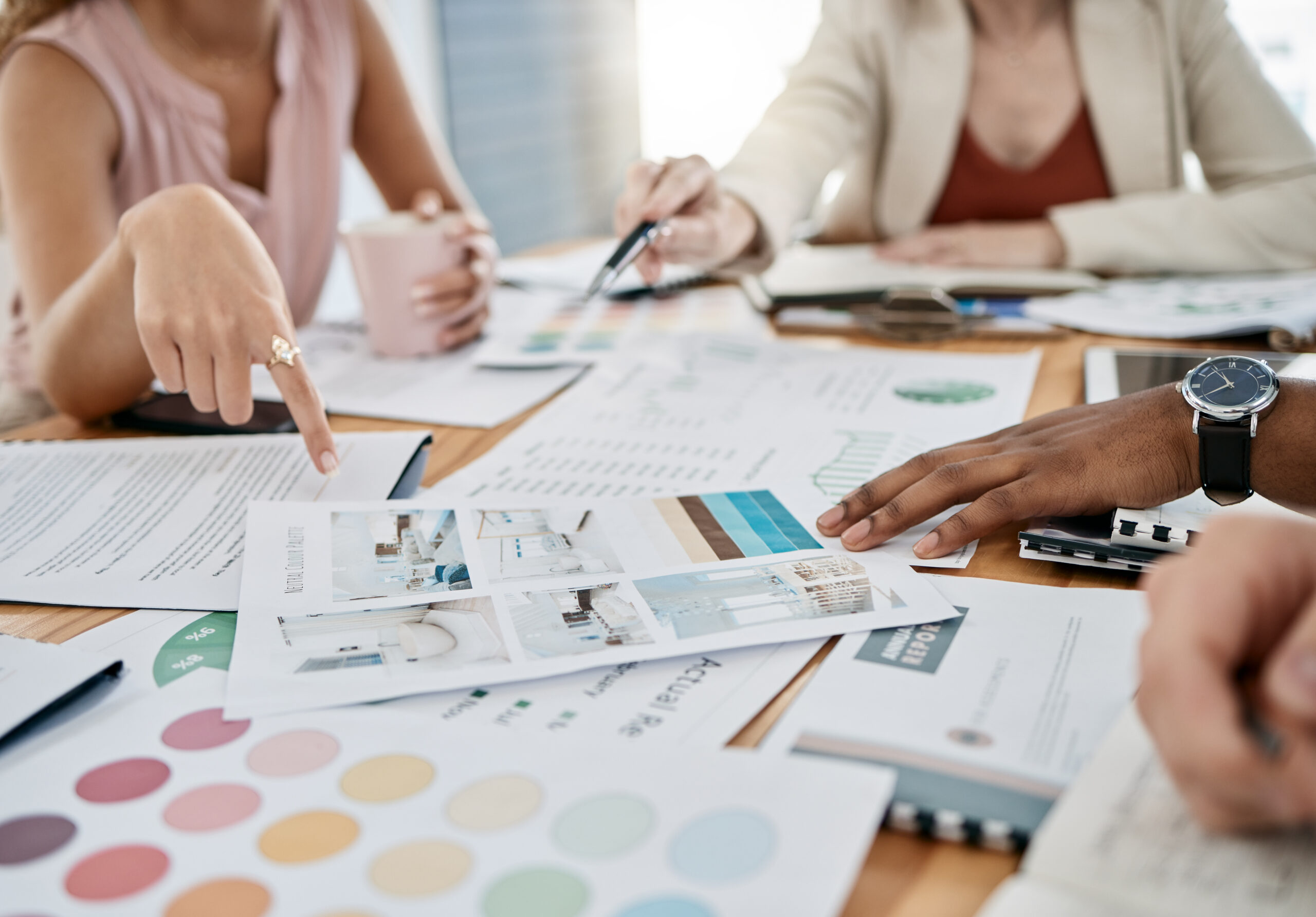 Professionals analyzing campaign materials to boost brand visibility and market presence.