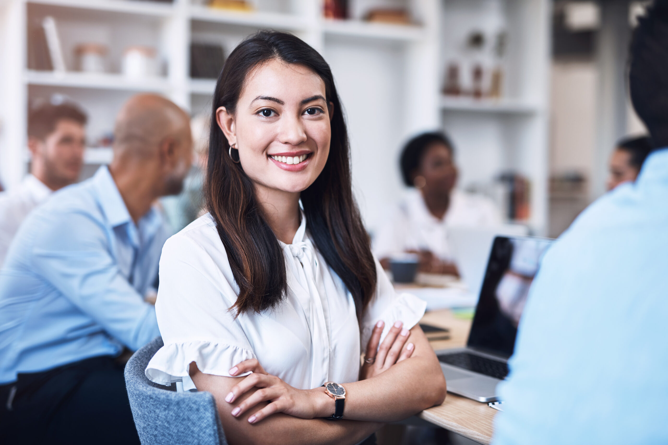 Young professional smiling confidently during her exciting first job experience.