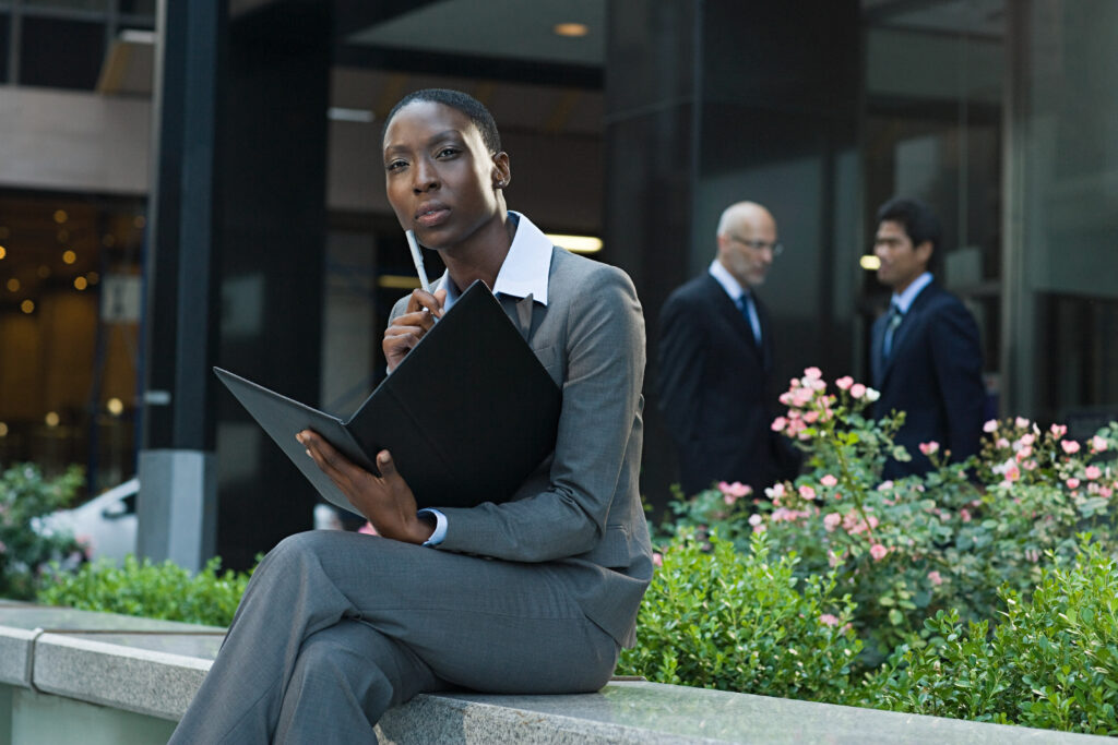 A woman sitting outside thinking