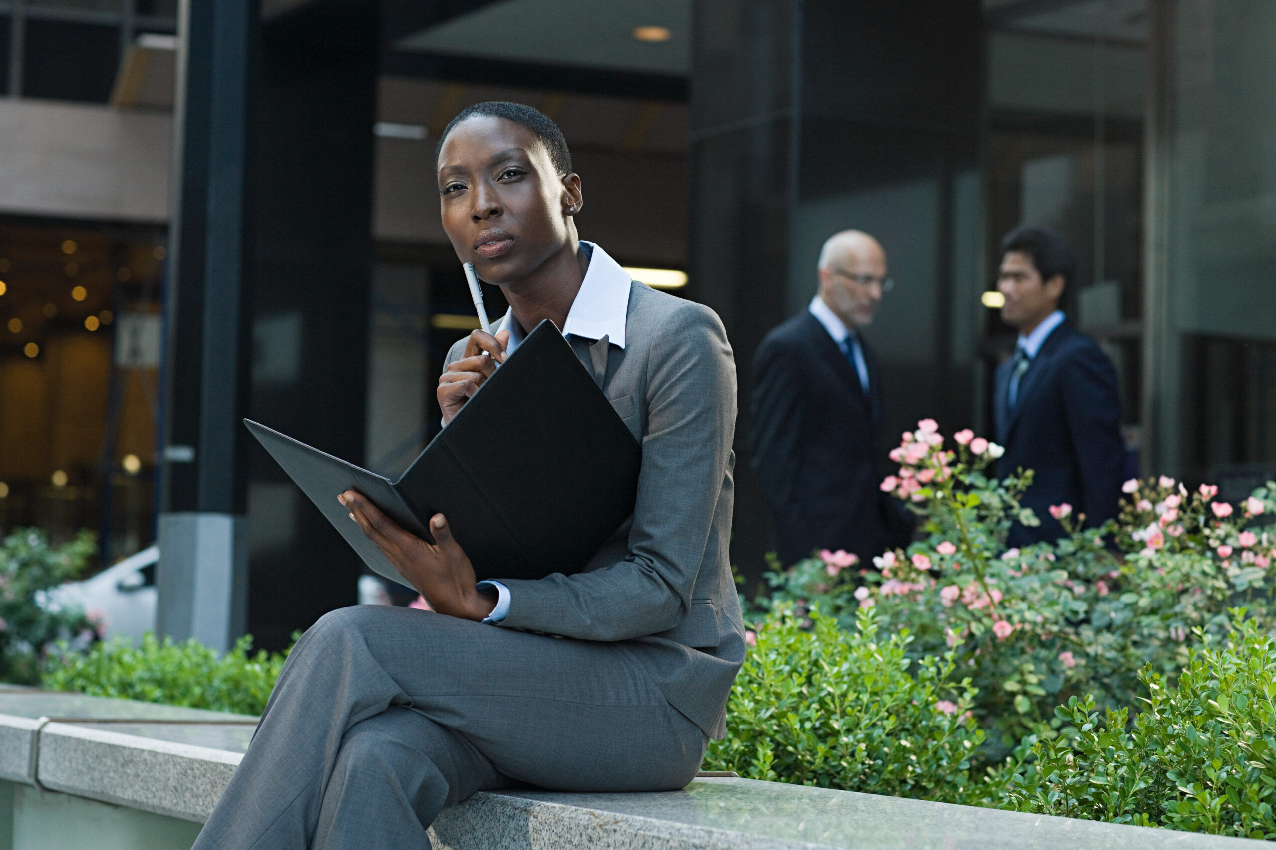 A woman sitting outside thinking